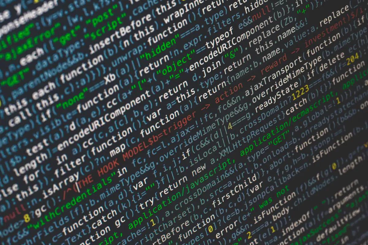 JavaScript source on a monitor, the layer a builder does not expose
