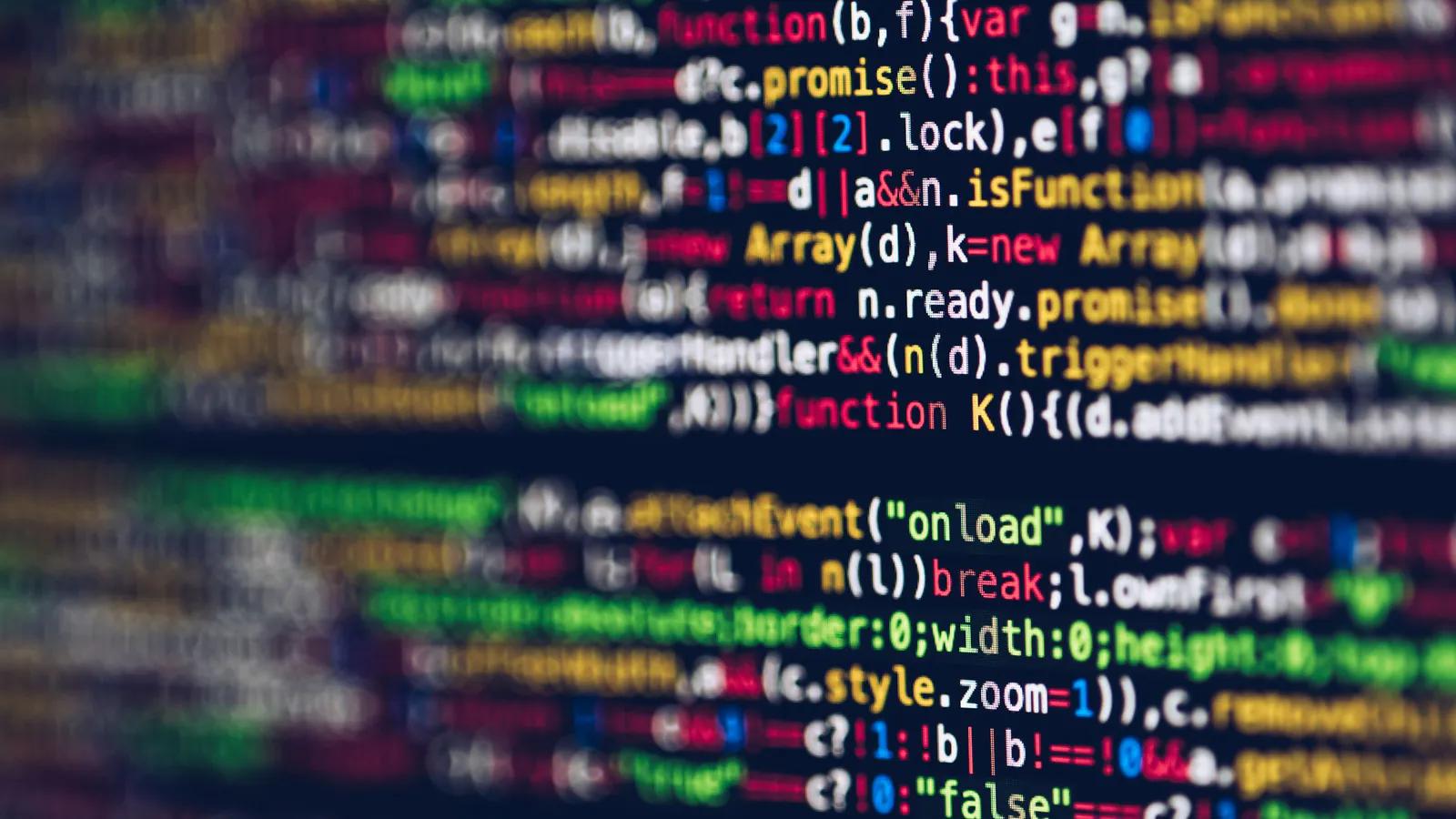 Lines of code on a screen, shot shallow so only one band is sharp