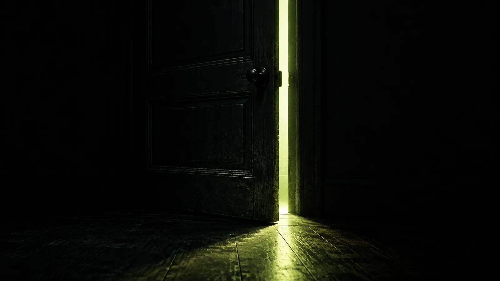 A heavy dark door left slightly ajar, lime light spilling through the gap onto the floor