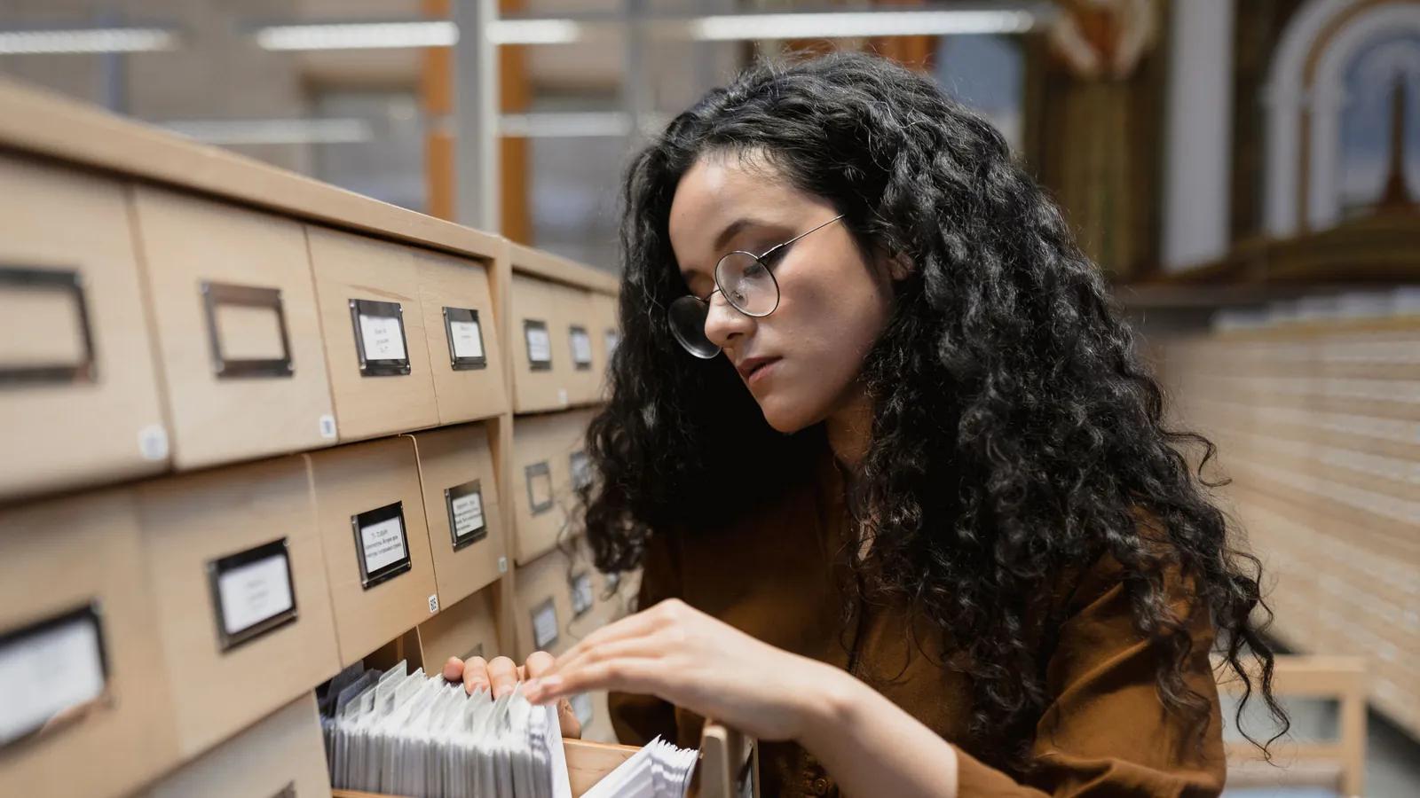 A reader searching a library card catalogue, structured records a machine can use