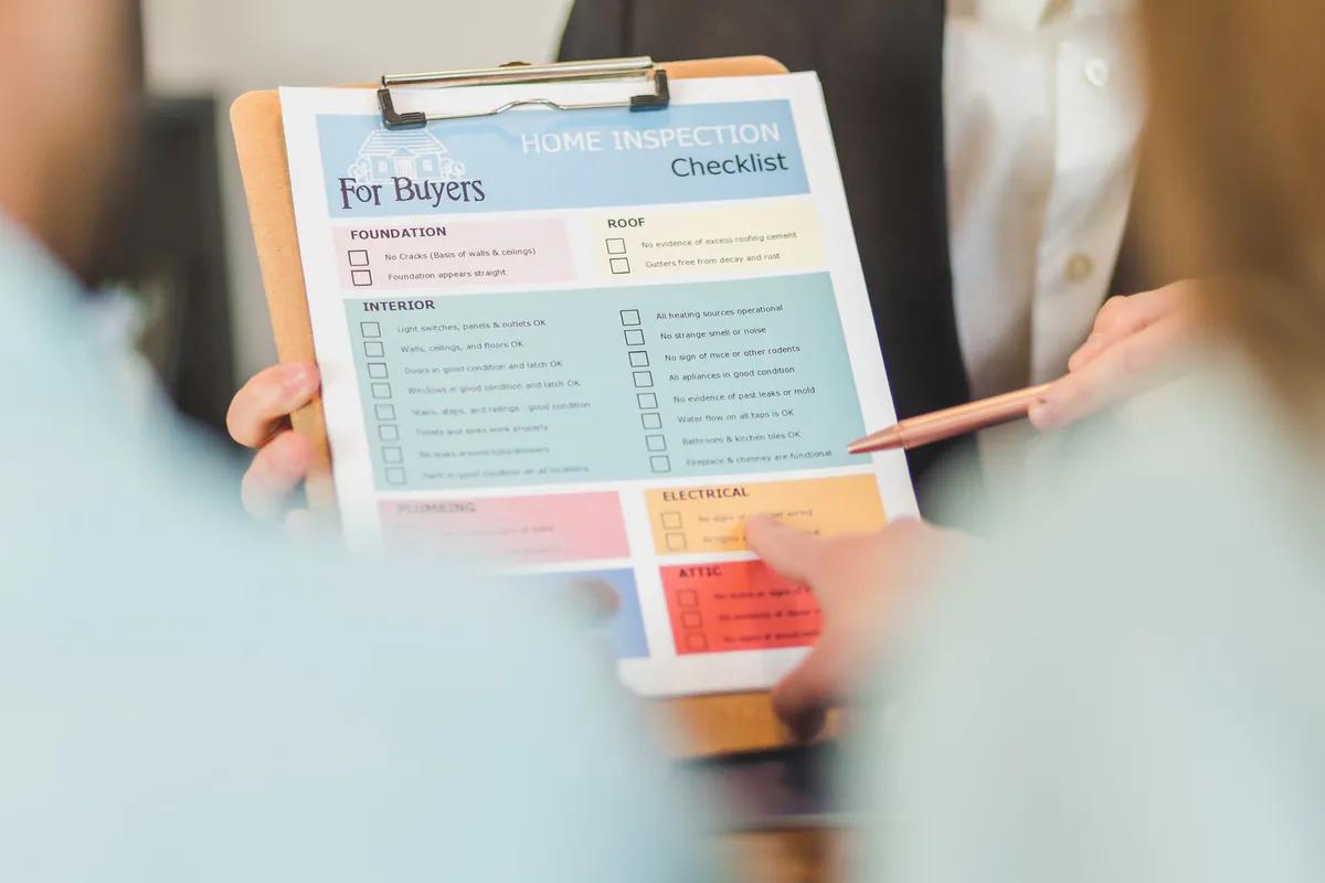 A checklist being worked through on a clipboard