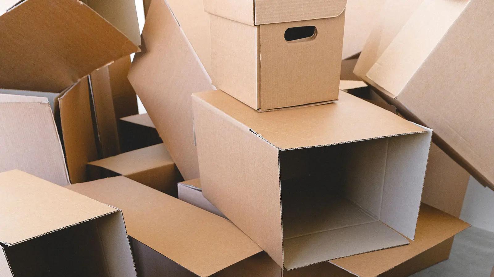 Flattened boxes stacked for a move, seen from above